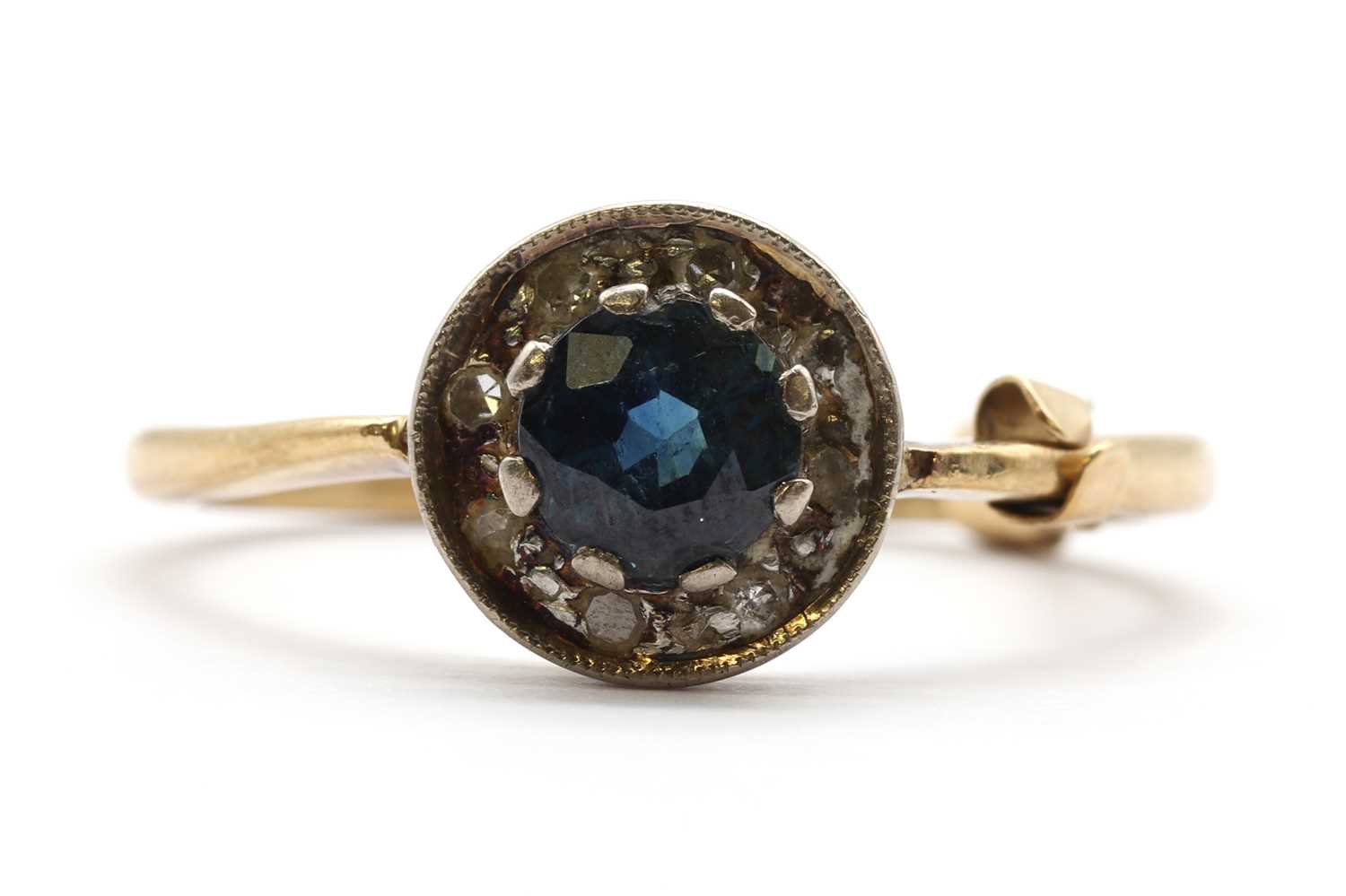 Lot 194 - A gold sapphire and diamond cluster ring