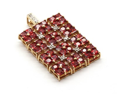 Lot 93 - A 9ct gold ruby and diamond pendant