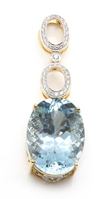 Lot 320 - An 18ct gold aquamarine and diamond pendant