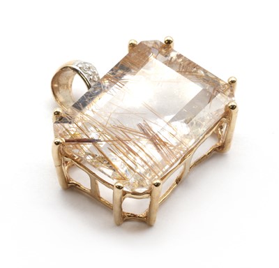 Lot 213 - A 9ct gold rutilated quartz and diamond pendant