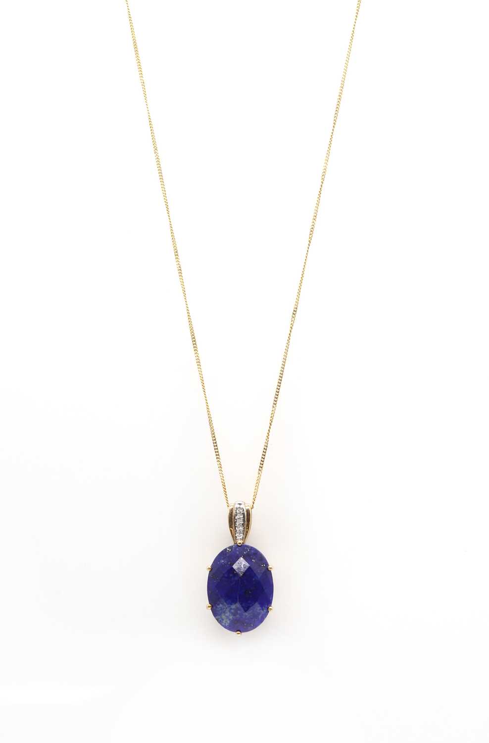 Lot 148 - A 9ct gold lapis lazuli and diamond pendant