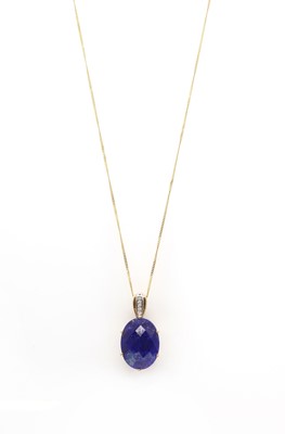 Lot 148 - A 9ct gold lapis lazuli and diamond pendant