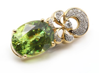 Lot 224 - An 18ct gold sphene and diamond pendant