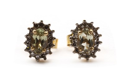 Lot 196 - A pair of gold zultanite and diamond cluster earrings