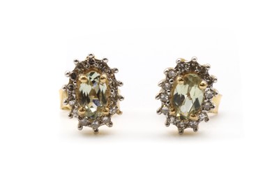 Lot 161 - A pair of gold zultanite and diamond cluster earrings