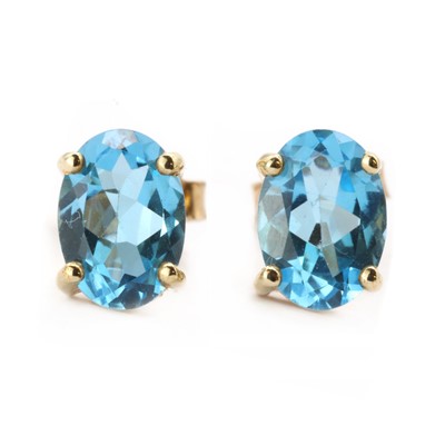 Lot 197 - A pair of 9ct gold single stone blue topaz earrings