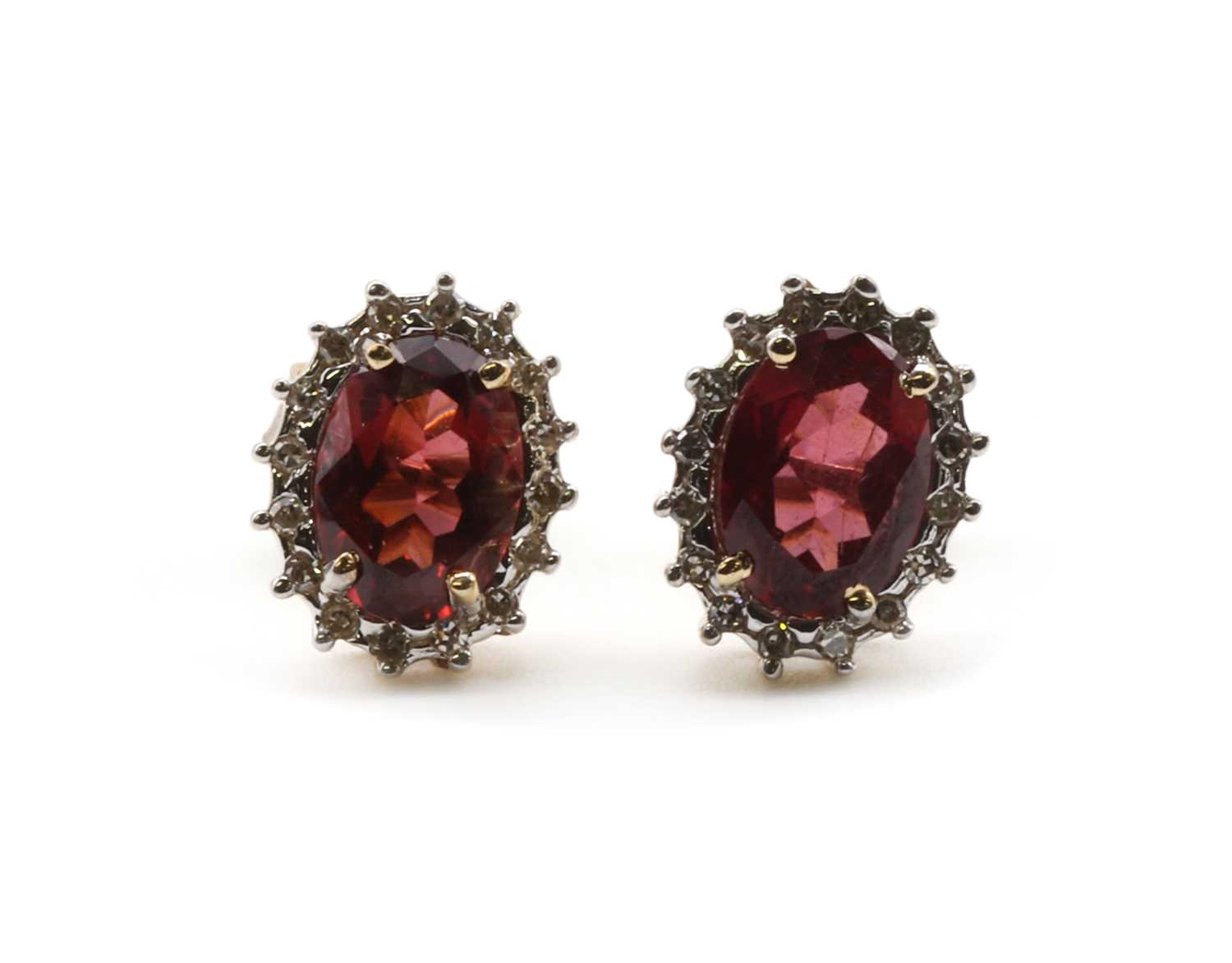 Lot 136 - A pair of garnet and diamond cluster earrings