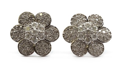Lot 77 - A pair of 9ct white gold diamond floral cluster earrings