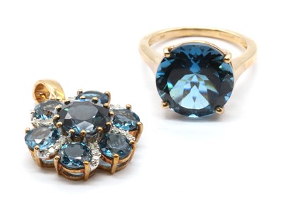 Lot 163 - A 9ct gold blue topaz and diamond cluster pendant