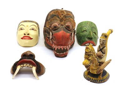 Lot 283 - A collection of carved polychrome Balinese masks