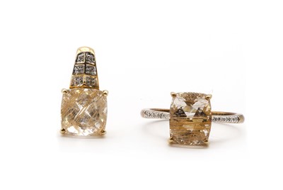 Lot 170 - A 9ct gold rutilated quartz and diamond ring