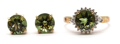 Lot 141 - A 9ct gold moldavite and diamond cluster ring