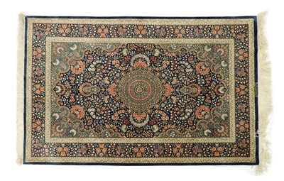 Lot 257 - A Persian signed silk rug
