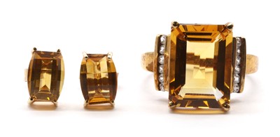 Lot 203 - A 9ct gold citrine and white zircon ring