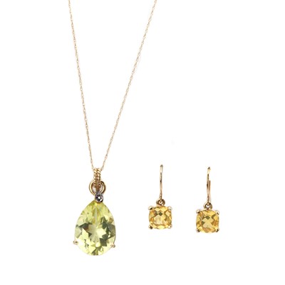 Lot 128 - A 9ct gold citrine and diamond pendant