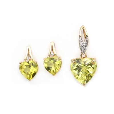 Lot 130 - A 9ct gold citrine and diamond pendant