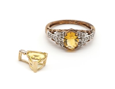 Lot 167 - A 9ct gold yellow fire opal and diamond ring