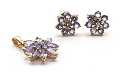 Lot 299 - A pair of gold tanzanite cluster earrings