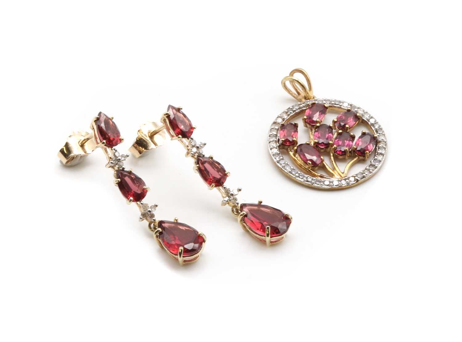 Lot 139 - A pair of gold garnet and diamond drop earrings