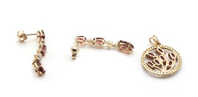 Lot 139 - A pair of gold garnet and diamond drop earrings