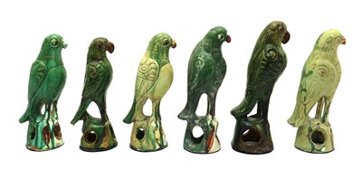 Lot 114 - A collection of six Chinese style pottery parrots