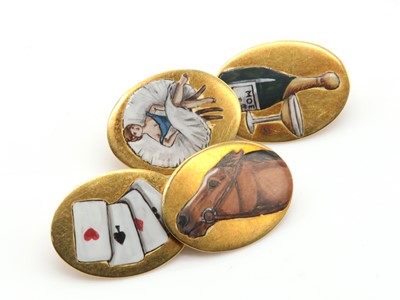 Lot 186 - A pair of gold enamel 'four vices' cufflinks