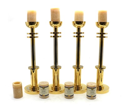 Lot 128A - A set of four Italian brass candle holders