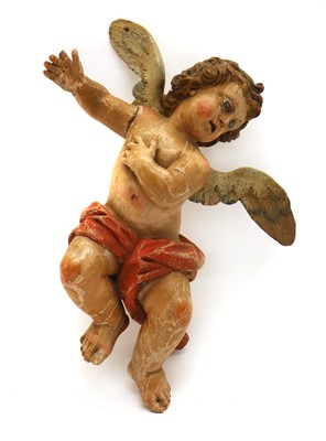 Lot 278 - A carved polychrome figure of a putto