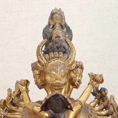 Lot 130 - A large Tibetan gilt-bronze group
