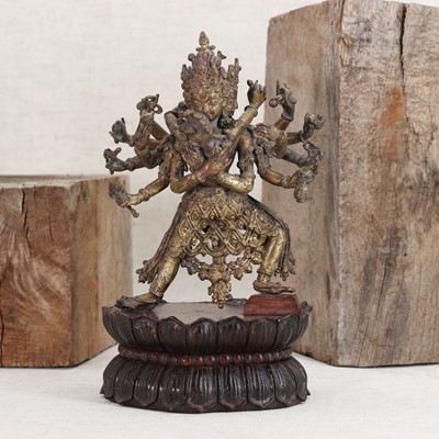 Lot 132 - A Nepalese gilt-bronze group