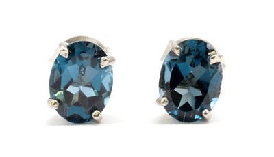 Lot 174 - A pair of silver blue topaz stud earrings