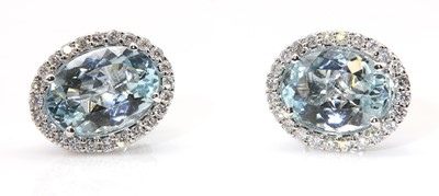 Lot 307 - A pair of white gold aquamarine and diamond cluster earrings