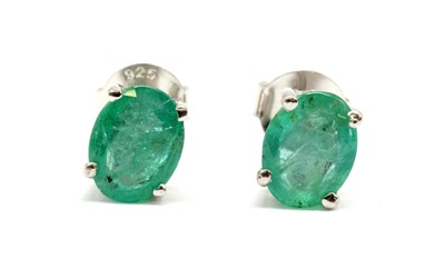 Lot 153 - A  pair of silver single stone emerald stud earrings