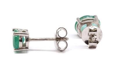Lot 153 - A  pair of silver single stone emerald stud earrings