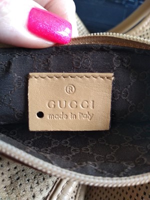 Lot 361 - A vintage Gucci tan perforated leather Jackie bag