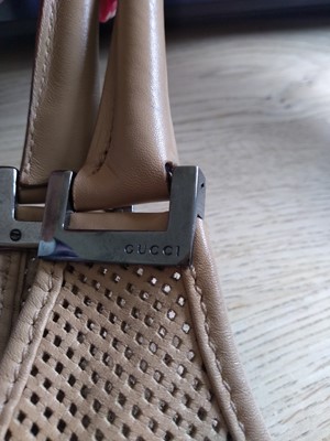 Lot 361 - A vintage Gucci tan perforated leather Jackie bag