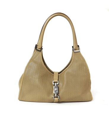 Lot 361 - A vintage Gucci tan perforated leather Jackie bag