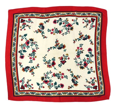 Lot 335 - A Chanel silk scarf, and three others