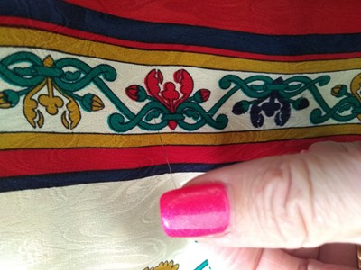 Lot 335 - A Chanel silk scarf, and three others