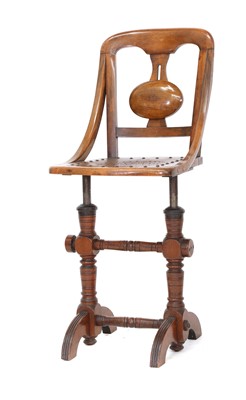 Lot 366 - A Victorian walnut music chair