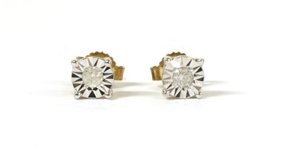 Lot 104 - A pair of gold single stone diamond stud earrings