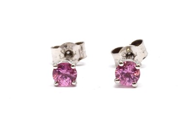 Lot 135 - A pair of 9ct white gold single stone pink sapphire stud earrings