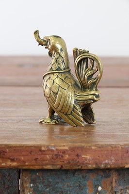 Lot 115 - A bronze oil lamp in the form of a cockerel