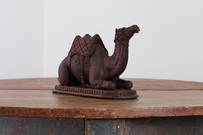 Lot 87 - A carved hardwood inkwell in the form of a seated camel