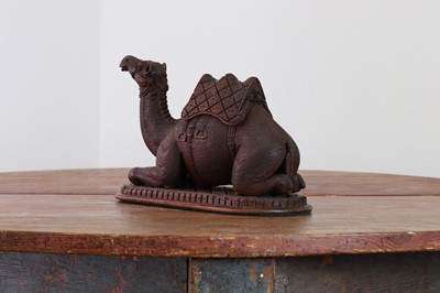 Lot 87 - A carved hardwood inkwell in the form of a seated camel