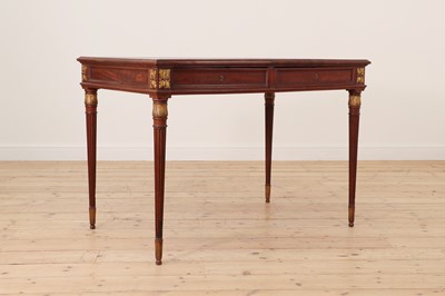 Lot 279 - A Louis XVI style mahogany bureau plat