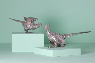 Lot 309 - A pair of silver models of pheasants