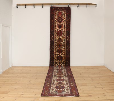 Lot 563 - A Persian Heriz wool runner