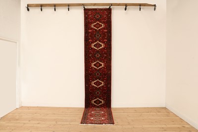 Lot 614 - A Persian Heriz wool runner