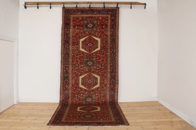 Lot 582 - A Persian Heriz wool carpet